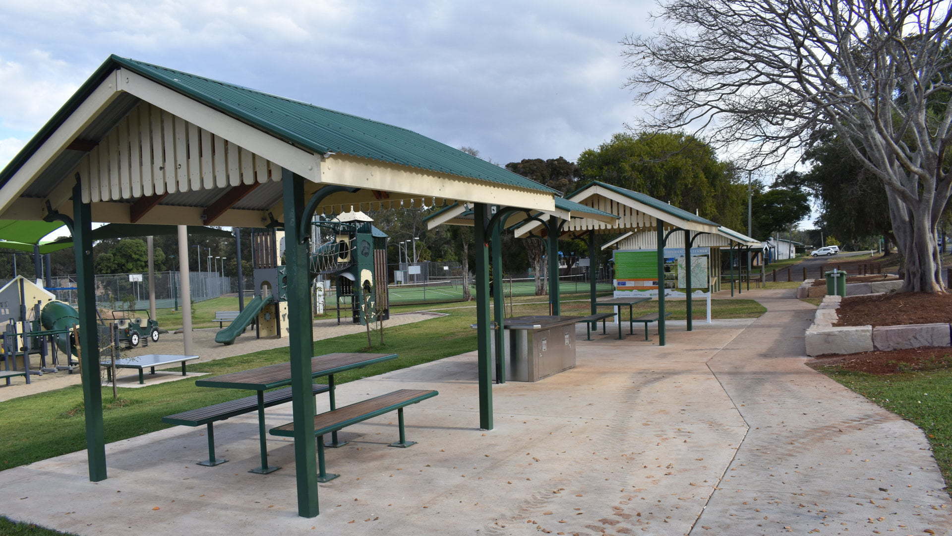 Picnic tables, BBQ and playground, at a park in Yarraman