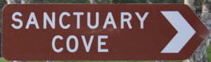 Brown sign for Sanctuary Cove
