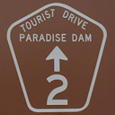 Paradise Dam Tourist Drive brown sign symbol