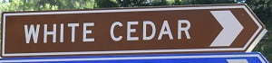 Brown sign for White Cedar