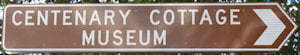 Brown sign for Centenary Cottage Museum