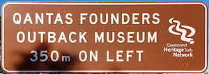 Brown sign for QANTAS Founders Outback Museum, 350m on left