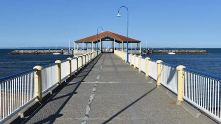 Looking down Redcliffe jetty towards to the middle pavilion, showing the lines down the centre representing the rail lines from previous versions of the jetty