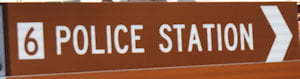 Brown sign for Police Station