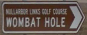 Brown sign for Nullarbor Links Golf Course Wombat Hole