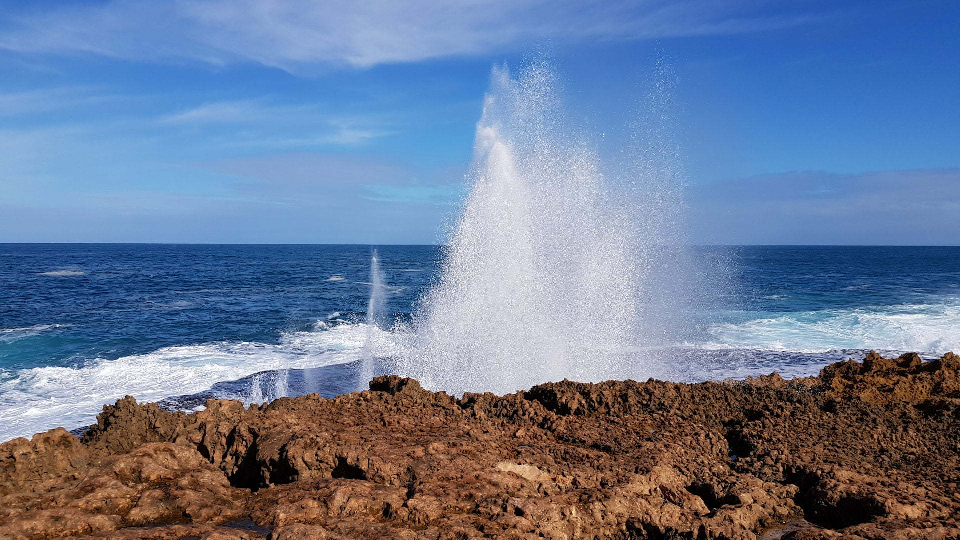 Water blowhole on a rocky coastline at the Blowholes in Western Australia