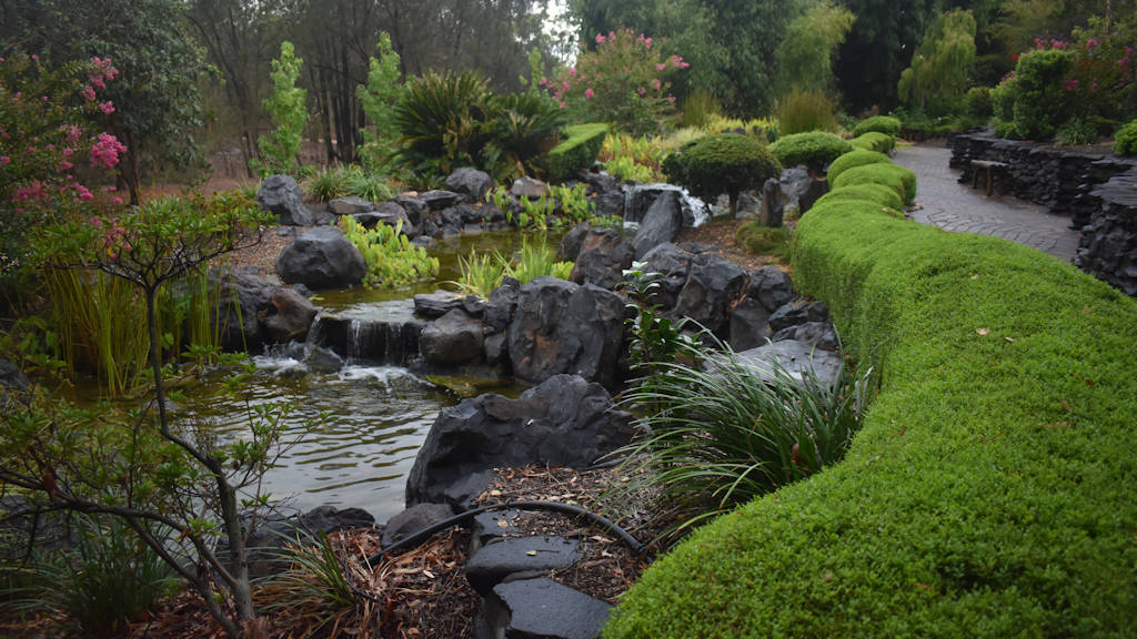 Path and stepped waterway of the Japanese Gardens at the Bundaberg Botanic Gardens Complex