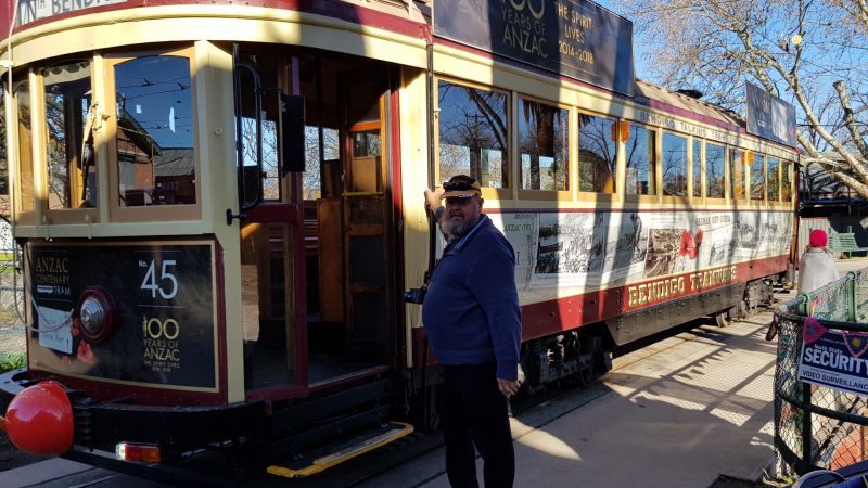Man about to board a tram, at the Talking Tram Tour in Bendigo