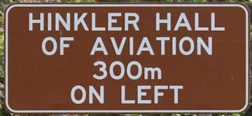 Brown sign for Hinkler Hall of Aviation, 300m on left