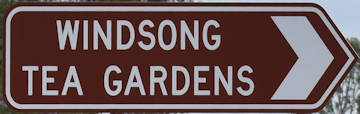 Brown sign for Windsong Tea Gardens