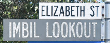 Brown sign (faded) for Imbil Lookout, white sign for Elizabeth St