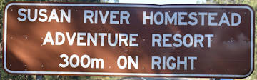 Brown sign for Susan River Homestead Adventure Resort, 300m on right
