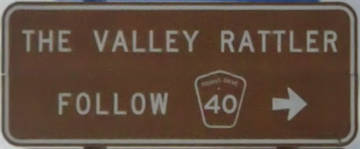 Brown sign for The Valley Rattler, follow tourist drive 40