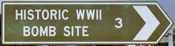 Brown sign for Historic WWII Bomb Site