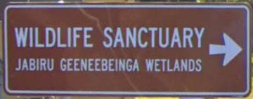Brown sign for Wildlife Sectuary Jabiru Geeneebeinga Wetlands