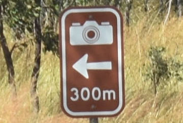 Brown sign for lookout, camera symbol, 300m