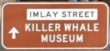 Brown sign for Killer Whale Museum, Imlay Street
