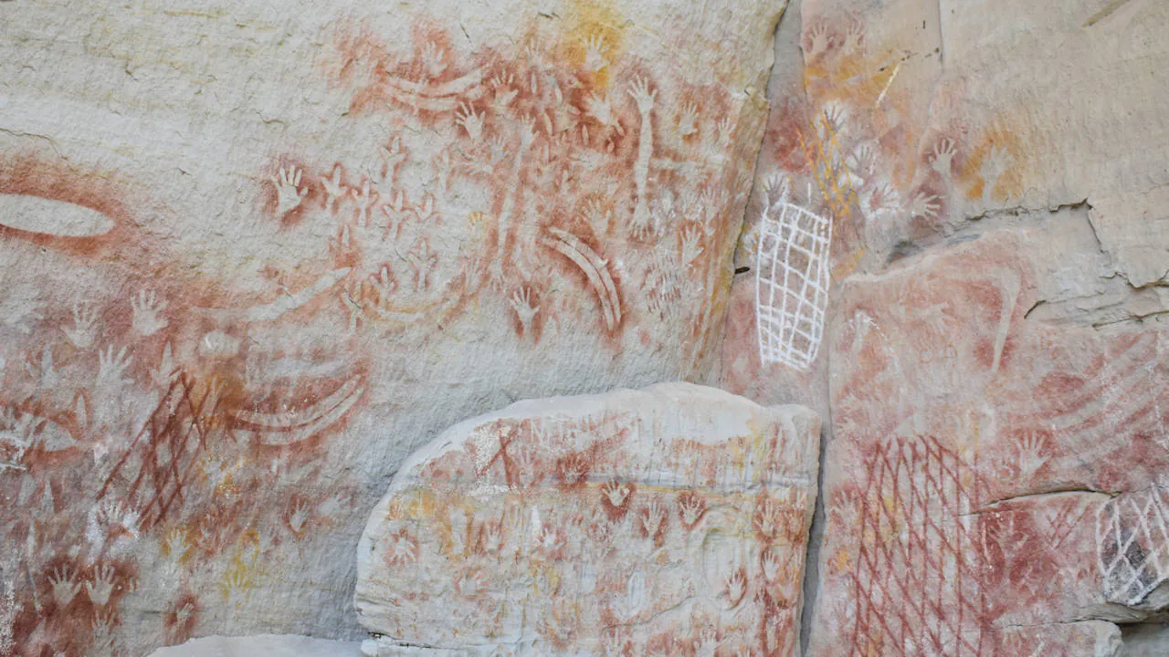 Aboriginal art paintings on a sandstone wall, taken at the Art Gallery in Carnarvon Gorge