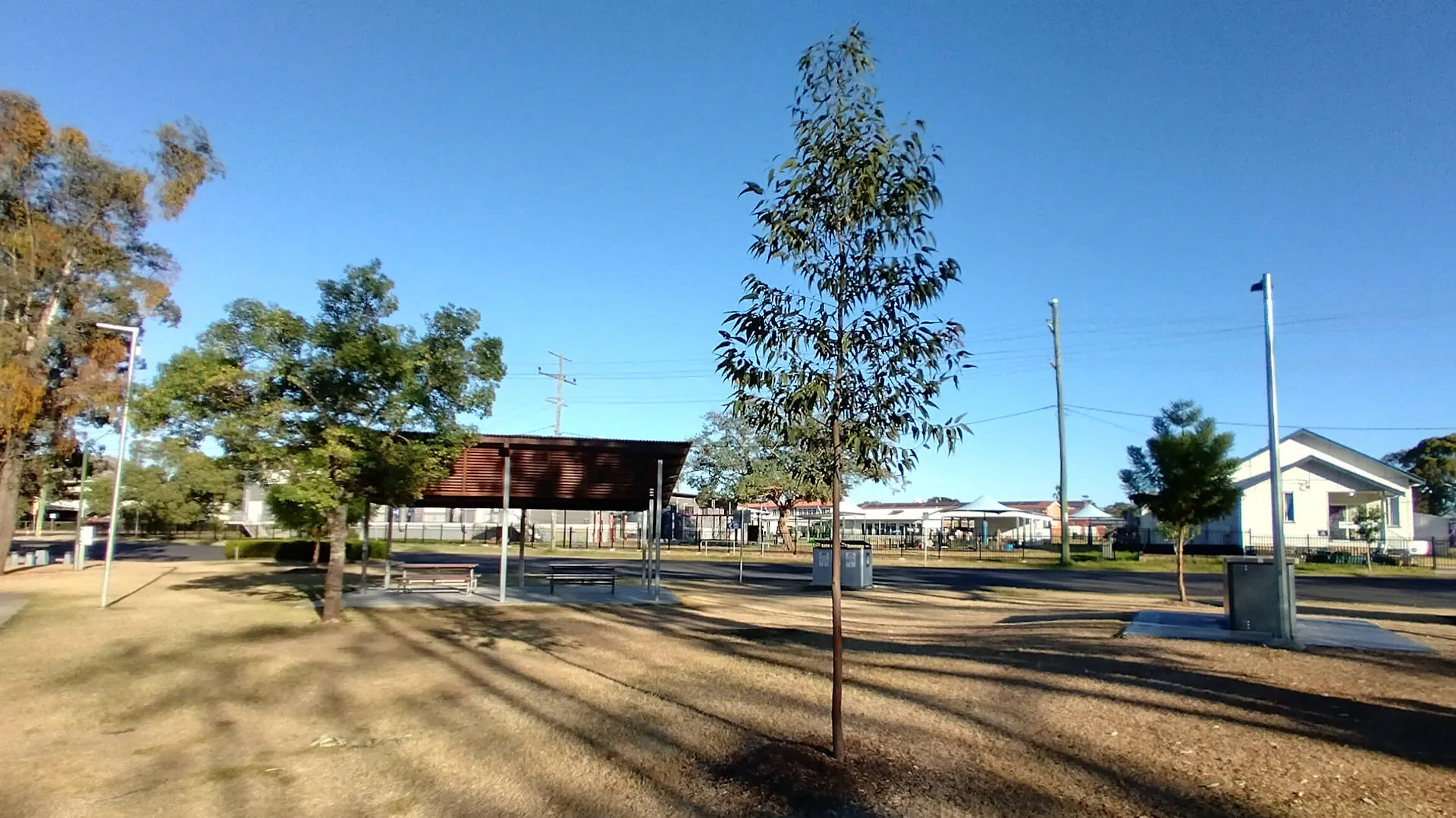 Park at Myall Creek in Dalby, sheltered picnic tables, bins, and BBQ