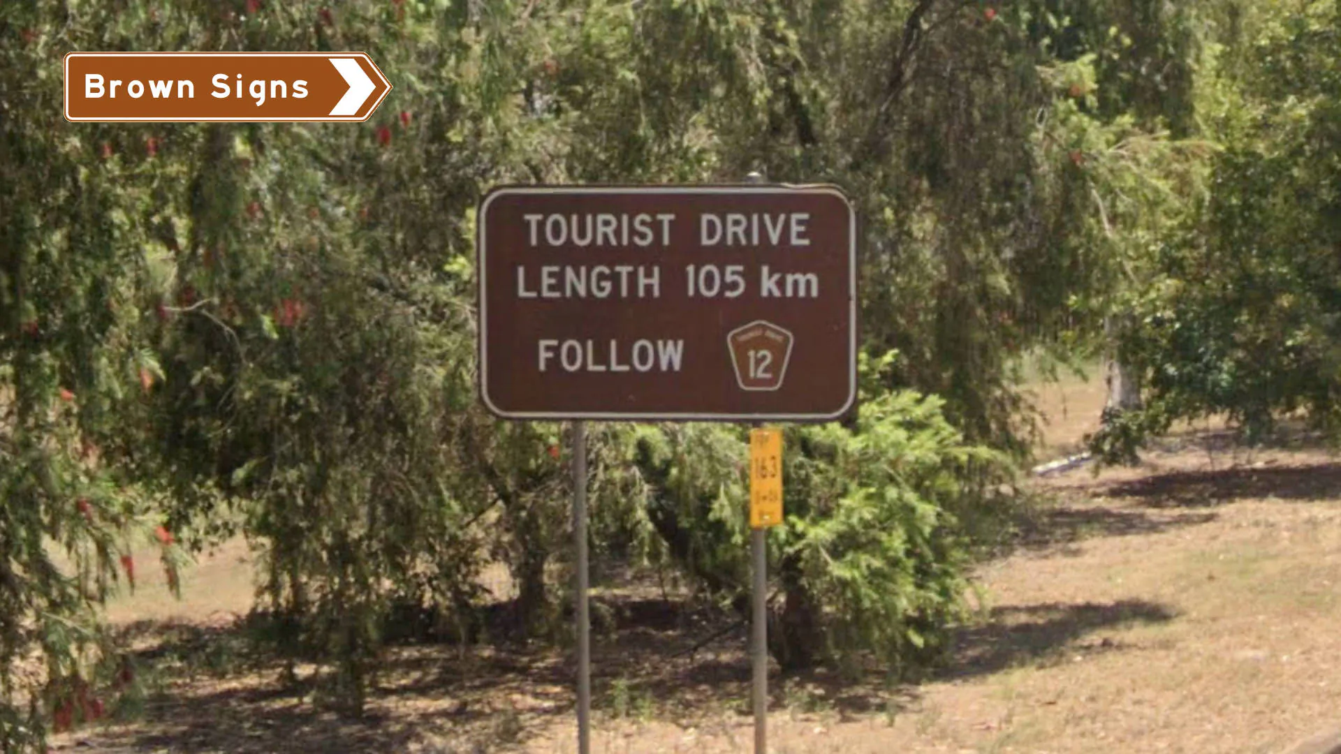 Brown sign for the Fraser Coast Tourist Drive, showing the start of Tourist Drive, length of 105km and a tourist drive symbol for tourist drive 12
