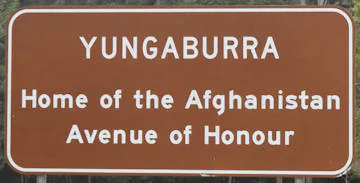 Brown sign for Yungaburra and Home of the Afghanistan Avenue of Honour